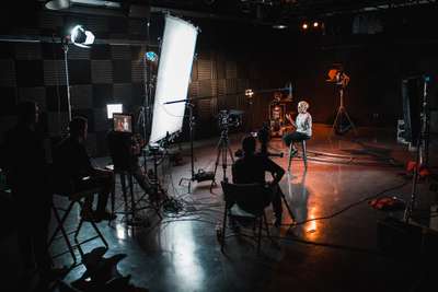 David interviewing a professor for program video.